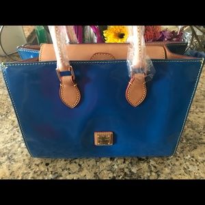 Brand new Dooney and Bourke patent leather purse.